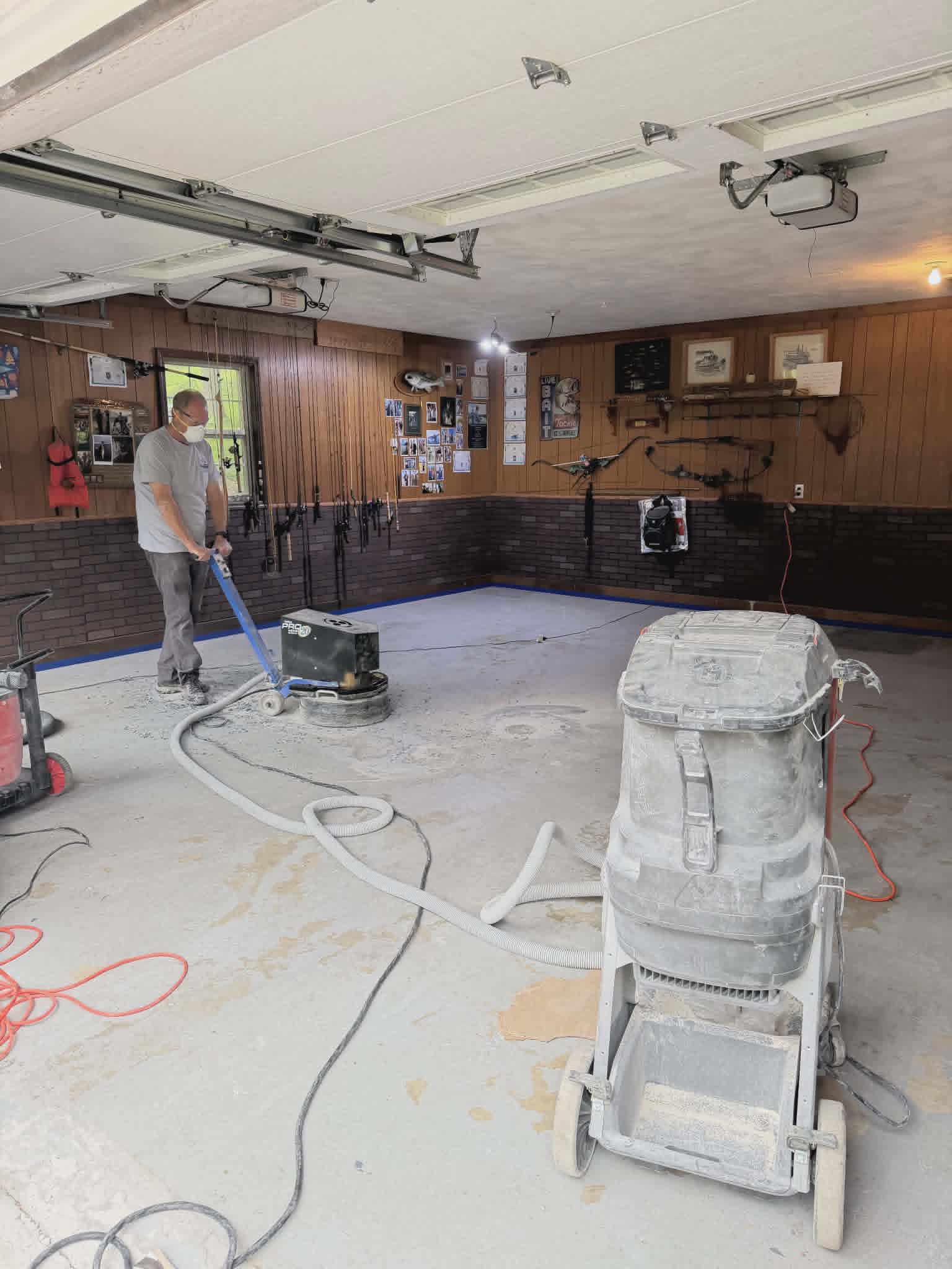 Diamond grinding concrete floor prep in a Missouri recreation room before epoxy coating
