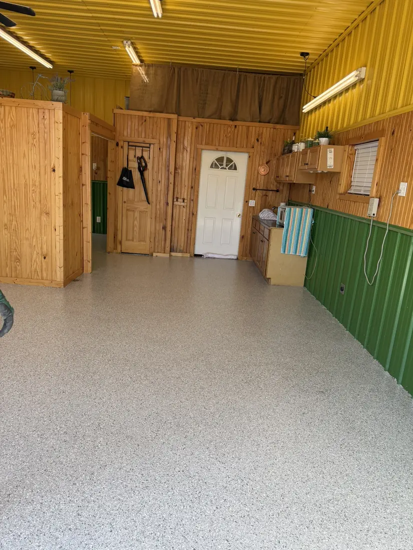 Finished gray, white and black flake epoxy floor installed by Show Me Epoxy in Belle, Missouri