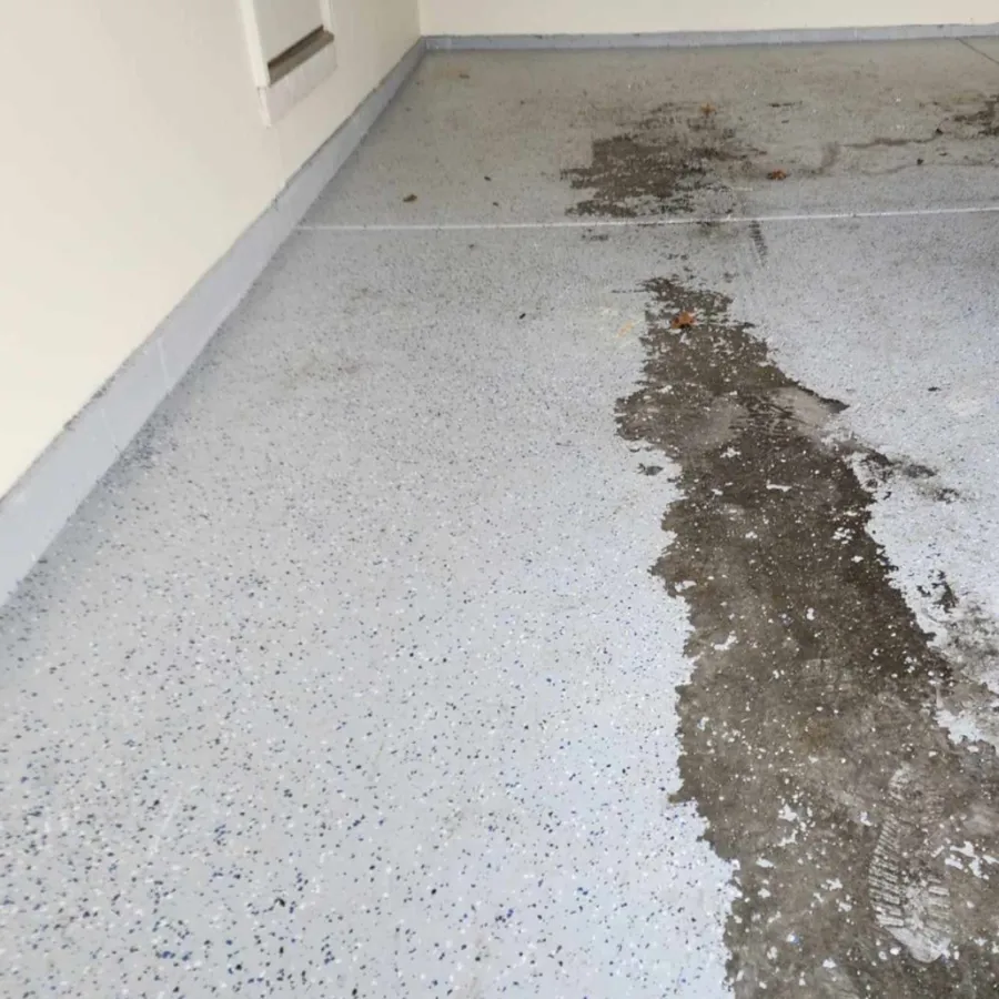 Failed peeling DIY epoxy garage floor coating before removal in Missouri