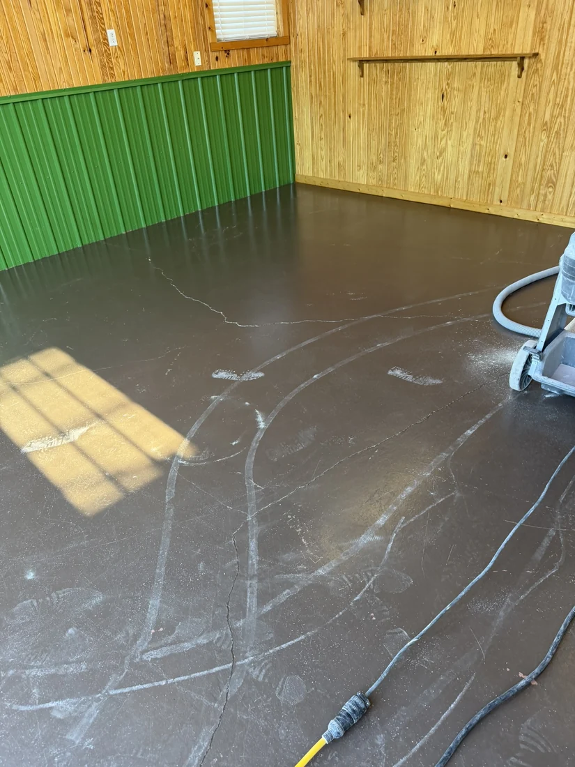 Worn brown shop floor during diamond grinding surface prep Belle Missouri
