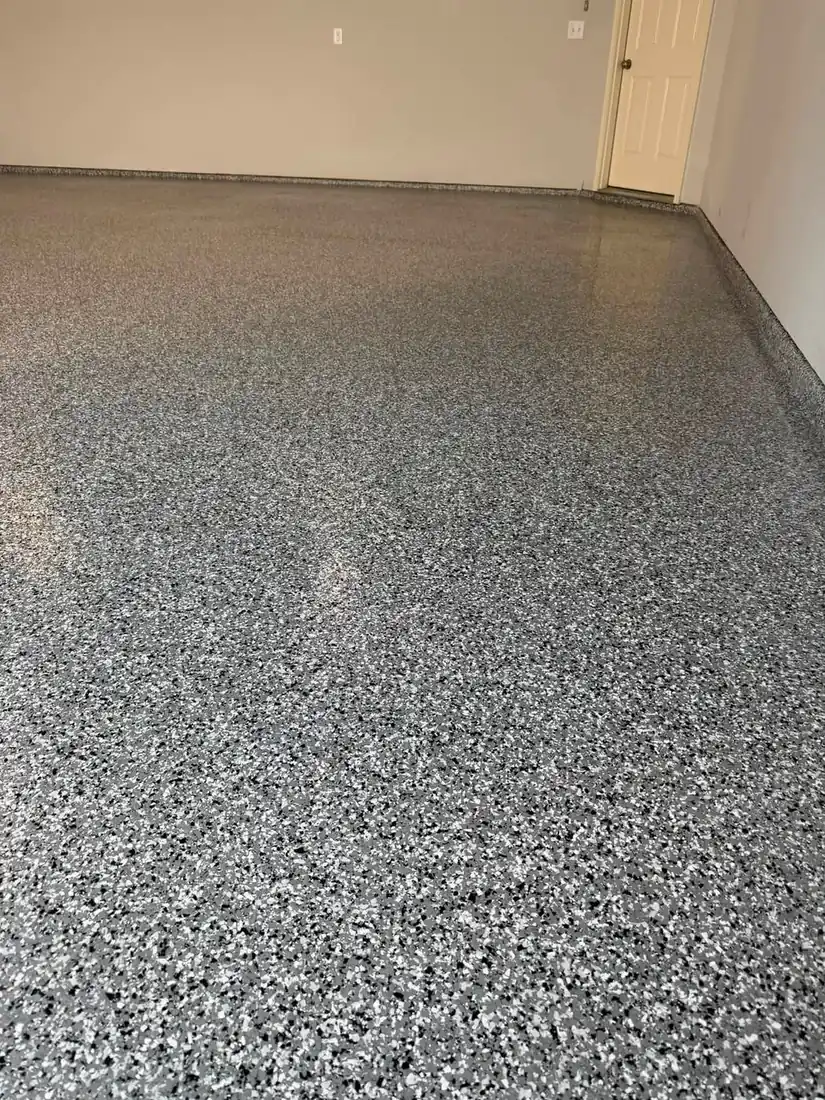Finished gray black white flake epoxy garage floor after coating Holts Summit Missouri