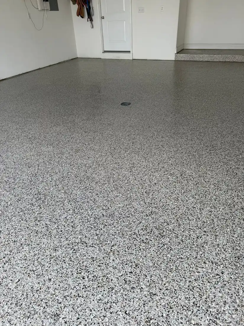 Finished tan brown gray flake epoxy garage floor after coating Jefferson City Missouri