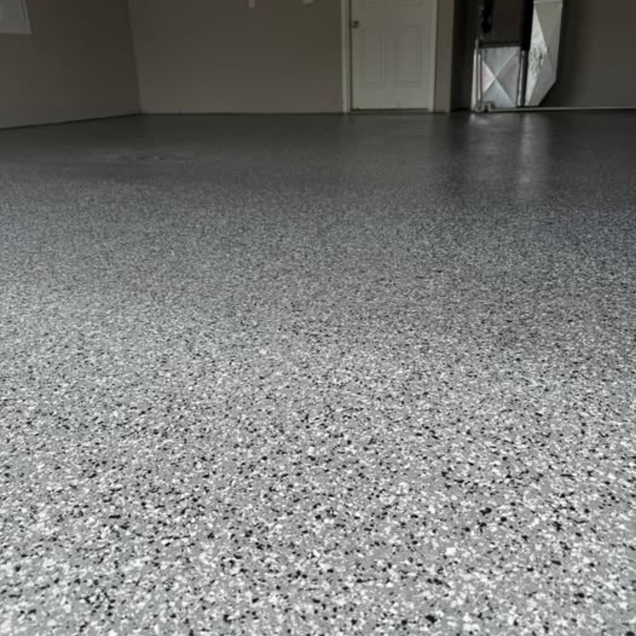 Black and white large flake epoxy garage floor Jefferson City