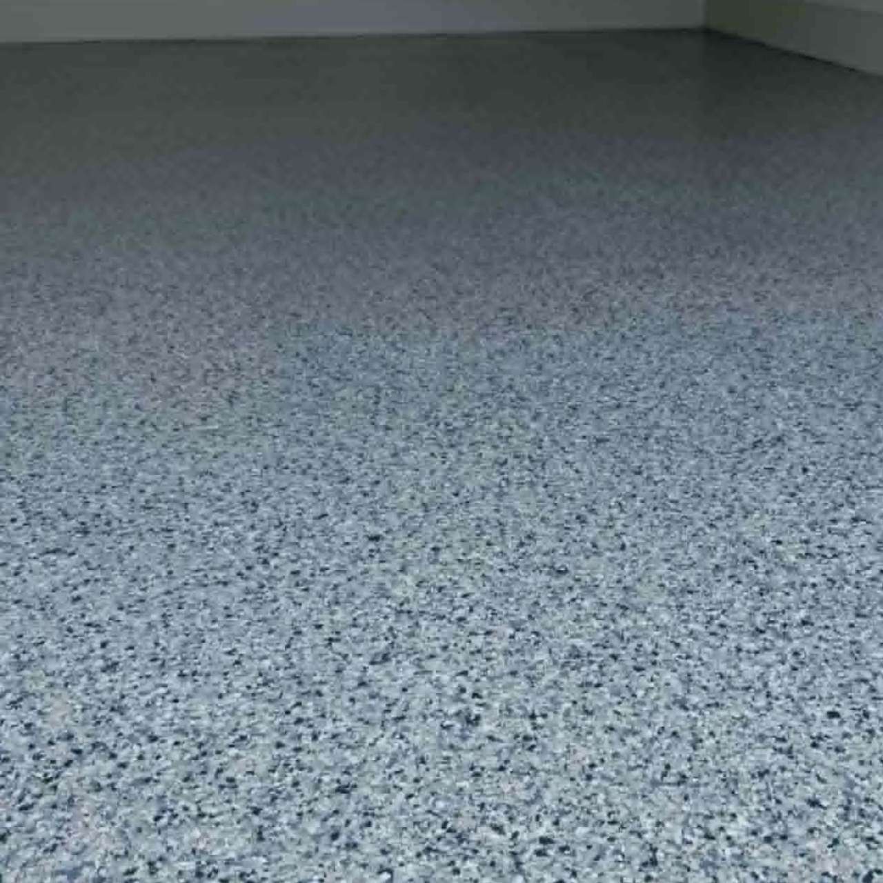 Light gray flake epoxy floor large open garage Missouri