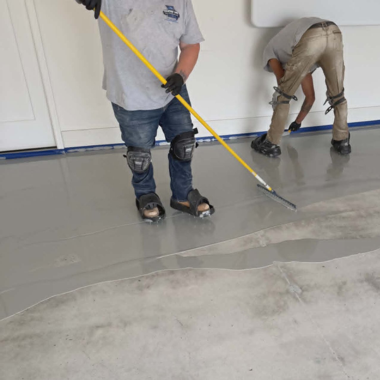Show Me Epoxy crew applying real two part epoxy basecoat garage floor Missouri