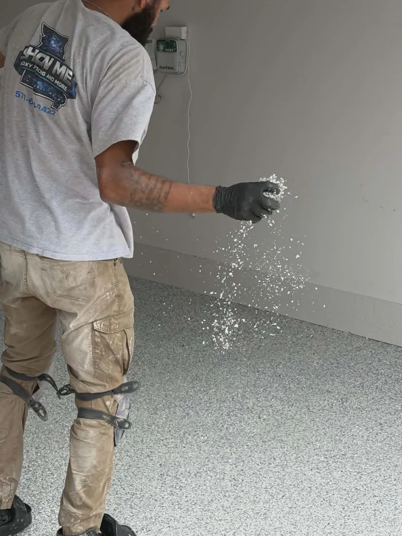 Show Me Epoxy crew broadcasting flake during a garage floor install
