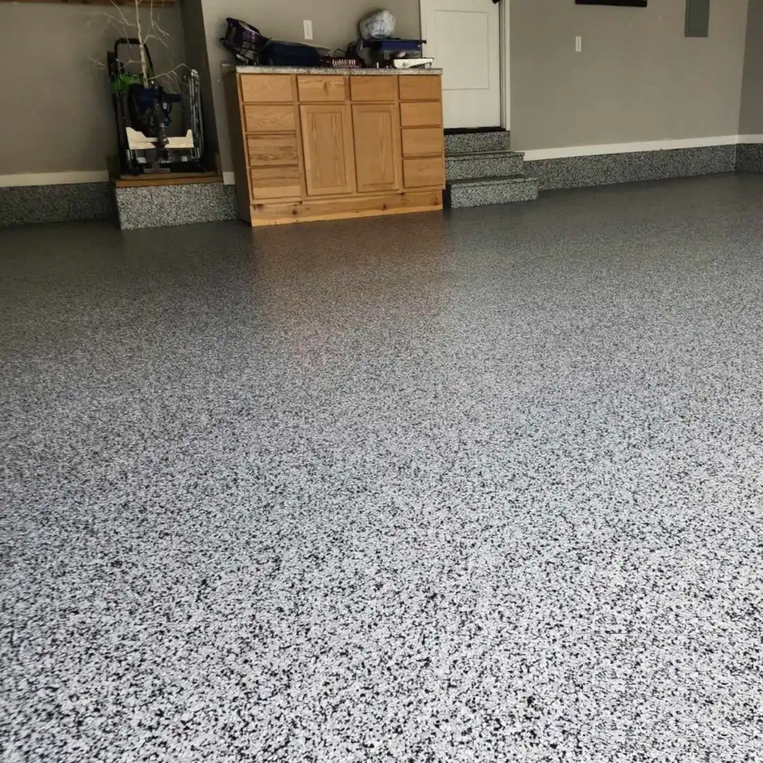 Epoxy garage floor black and white flake low angle Jefferson City Missouri