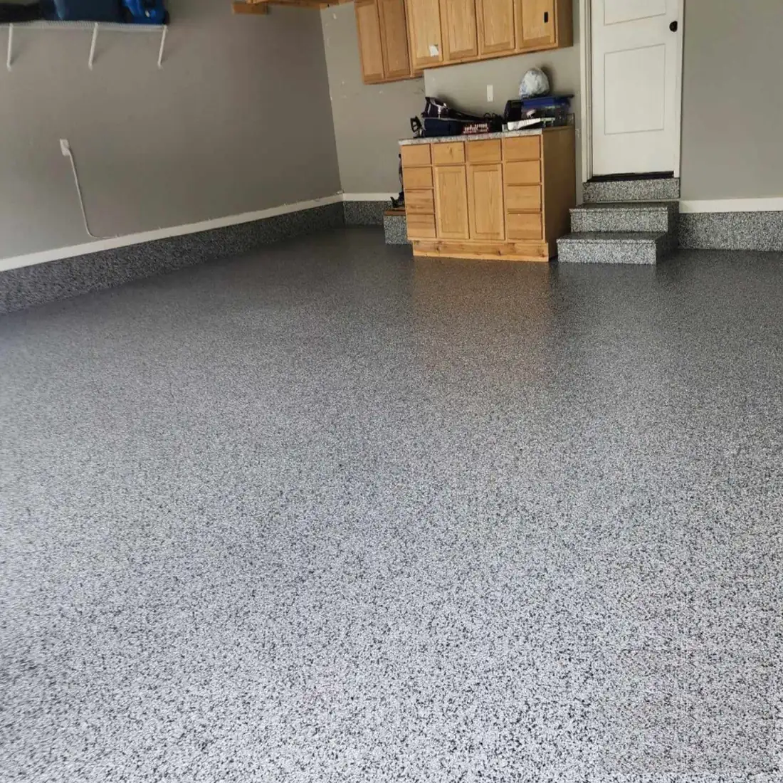 Epoxy garage floor Houndstooth flake driveway transition Jefferson City Missouri