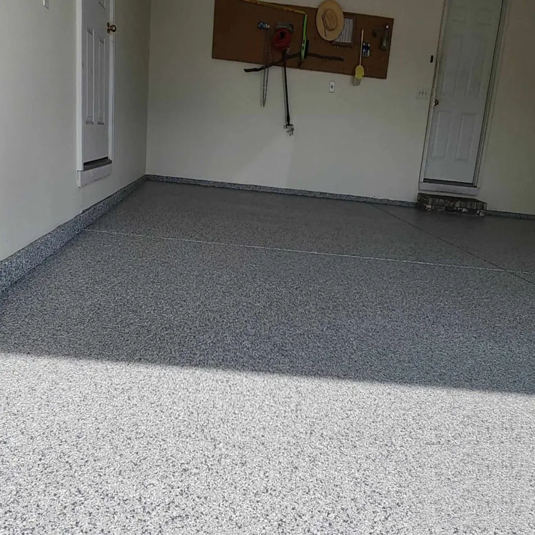 Epoxy workshop garage floor black and white flake with cabinets Missouri