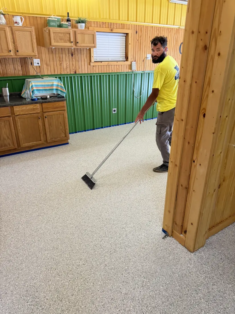 Show Me Epoxy installer broadcasting flake into wet basecoat Belle Missouri