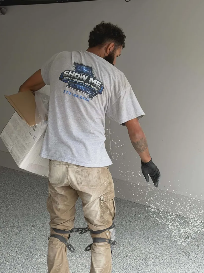 Show Me Epoxy installer in branded uniform broadcasting flake Jefferson City Missouri