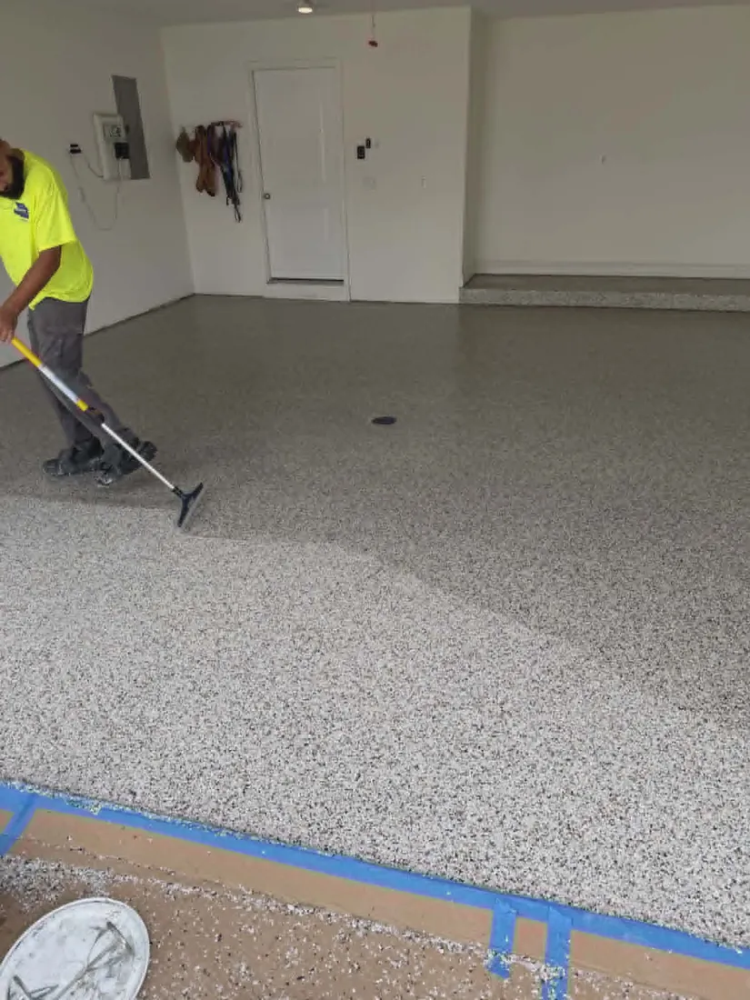 Show Me Epoxy installer rolling epoxy base coat garage floor Jefferson City Missouri